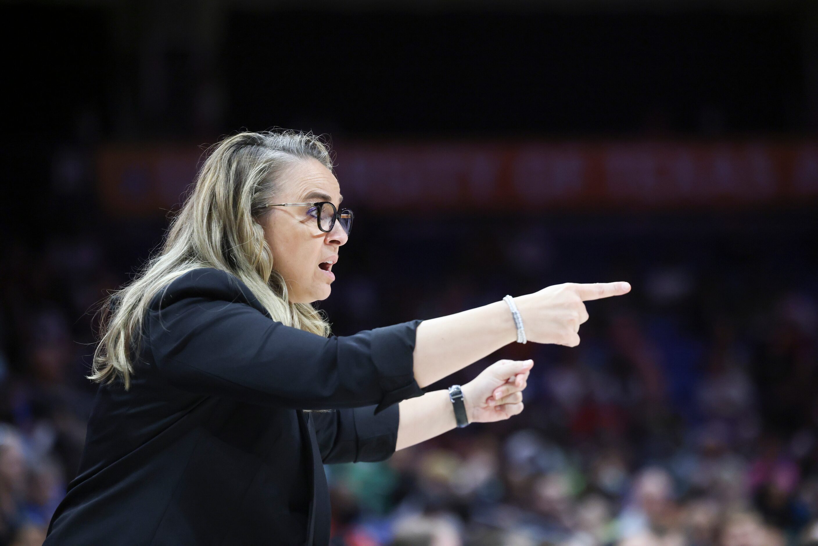 Becky Hammon, Las Vegas Aces Head Coach, yells to players on the court in the game against...