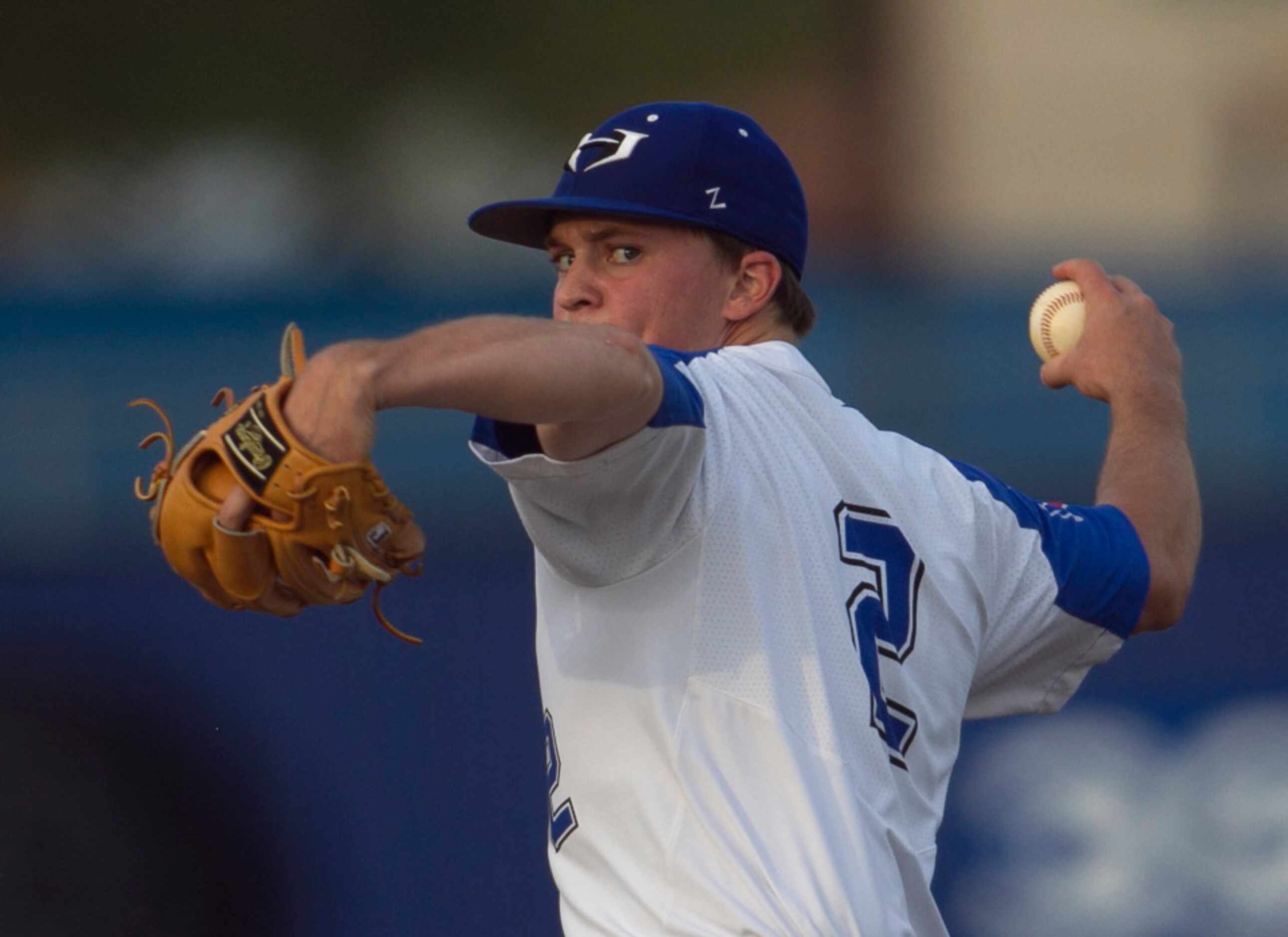 Hebron pitcher Jeremy Slate (2) prepares to deliver a pitch to a Coppell batter in the top...