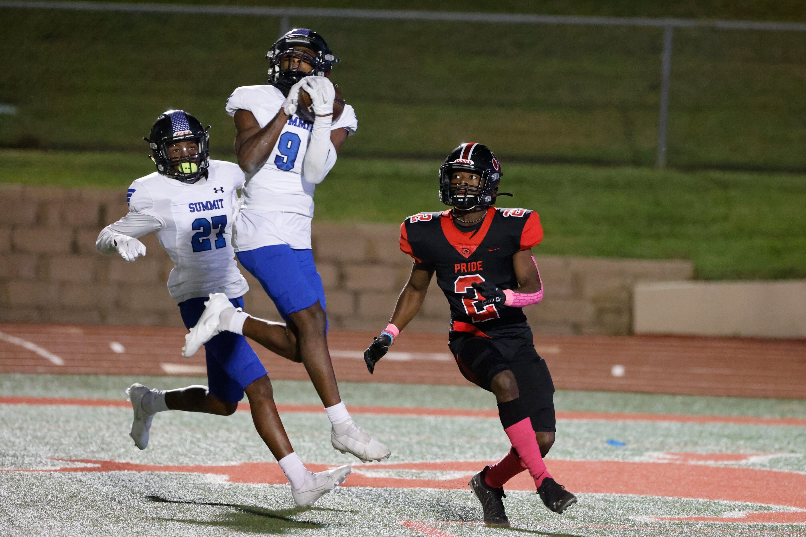 Mansfield Summit defender Tavare Smith (9) makes and interception in front of Colleyville...