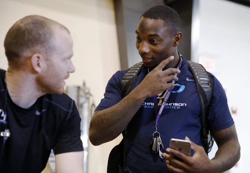 Michael Johnson Performance Center combine director Brian Abadie talks with Derrick Kindred...