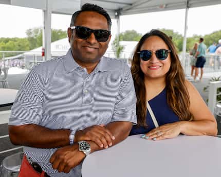 Sam Manohar (left) stands with his wife Shaheen Manohar, at the 17th hole during the first...