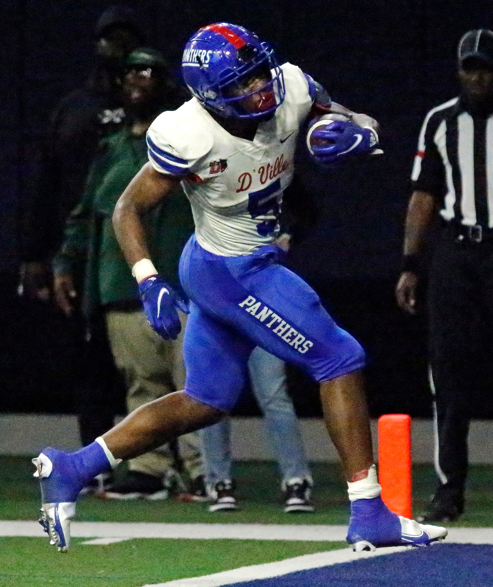 Duncanville High School running back Malachi Medlock (5) scores a touchdown during the first...