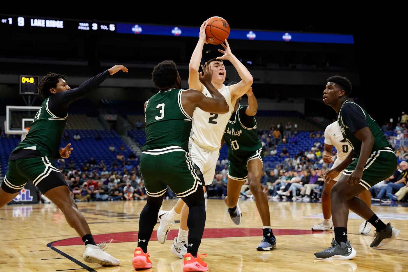 Plano East's Narit Chotikavanic (2) tries to drive past Mansfield Lake Ridge's Ehi Akharoh...