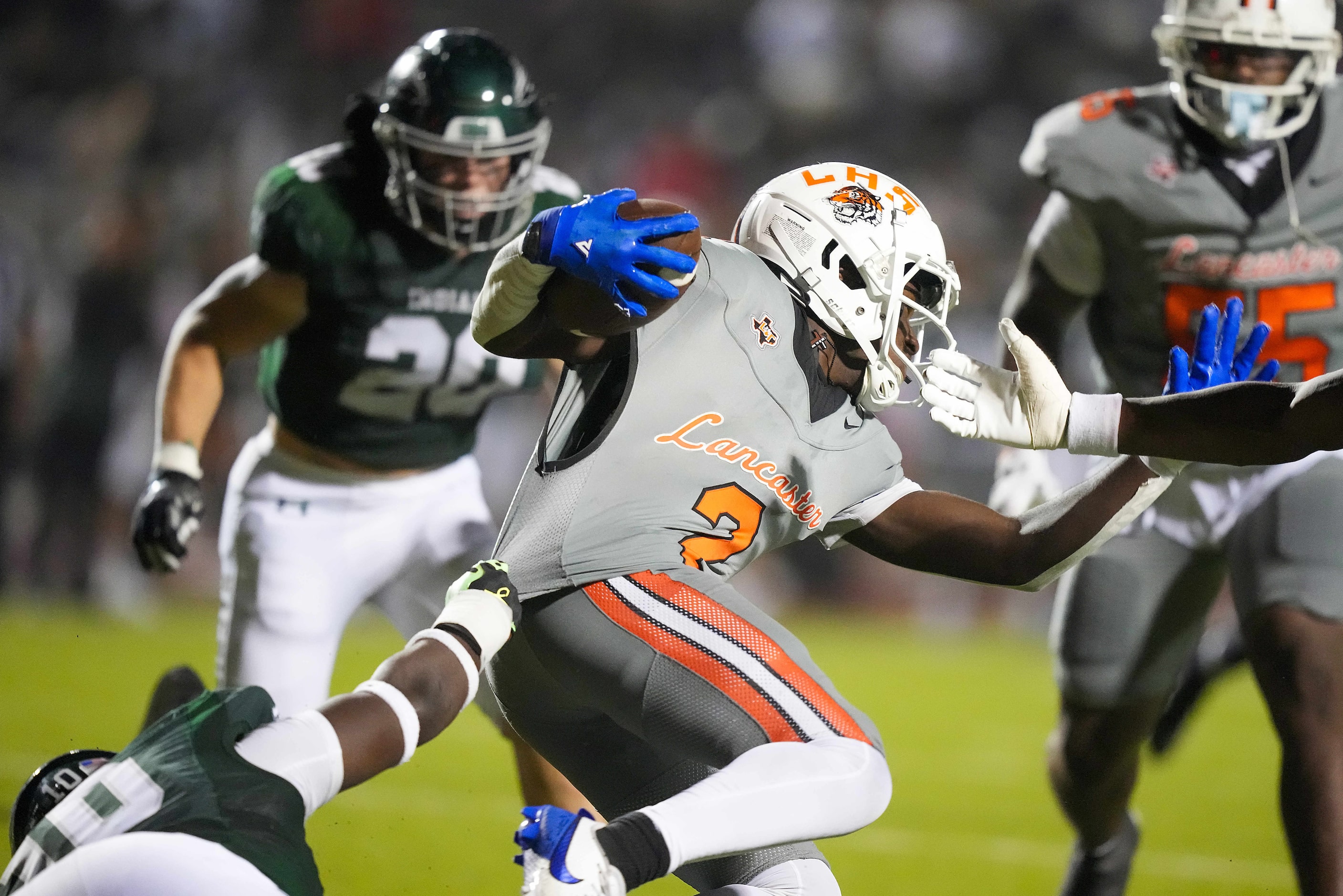 Lancaster running back Izayah Lee (2) is pulled down by Waxahachie defensive lineman Cade...