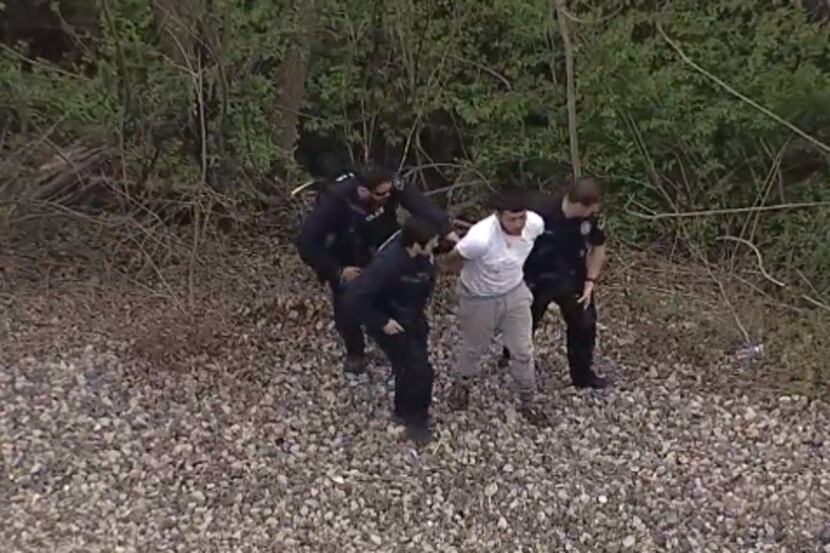 Dallas police arrested two people after a foot chase Monday afternoon.