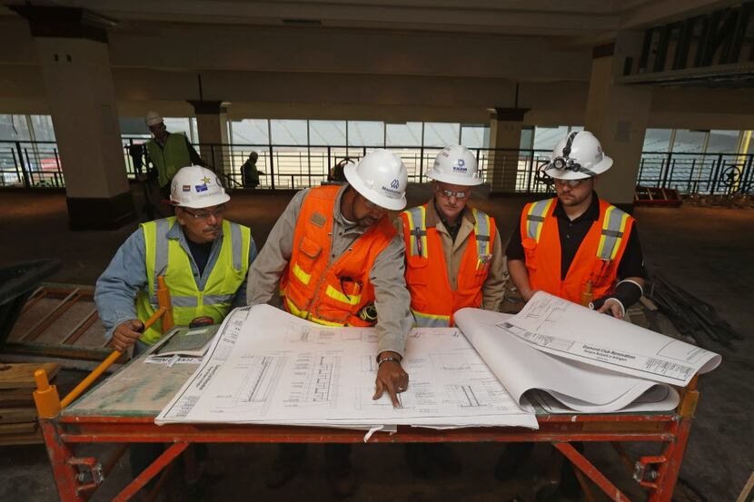 Construction workers Rafael Martinez, Richard Black, Robert McCloud and Zach Hladek (cq)...