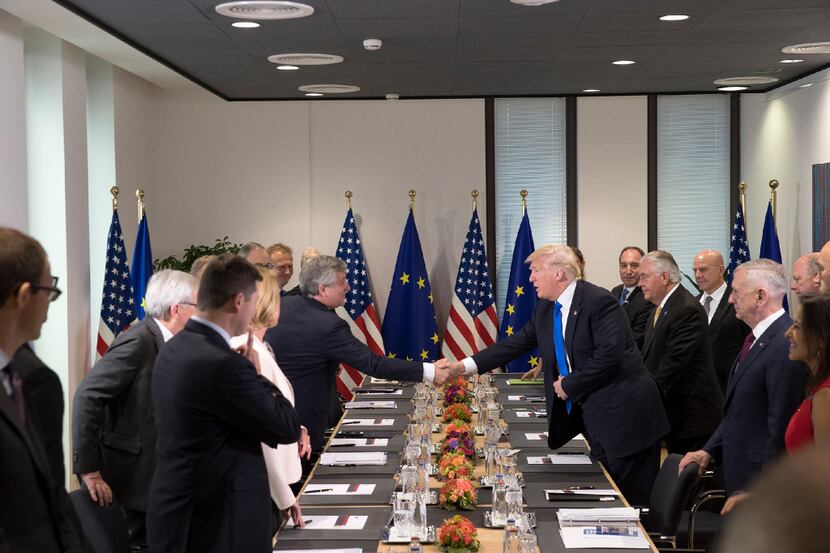 President Donald Trump shakes hands with European Parliament President Antonio Tajani at the...