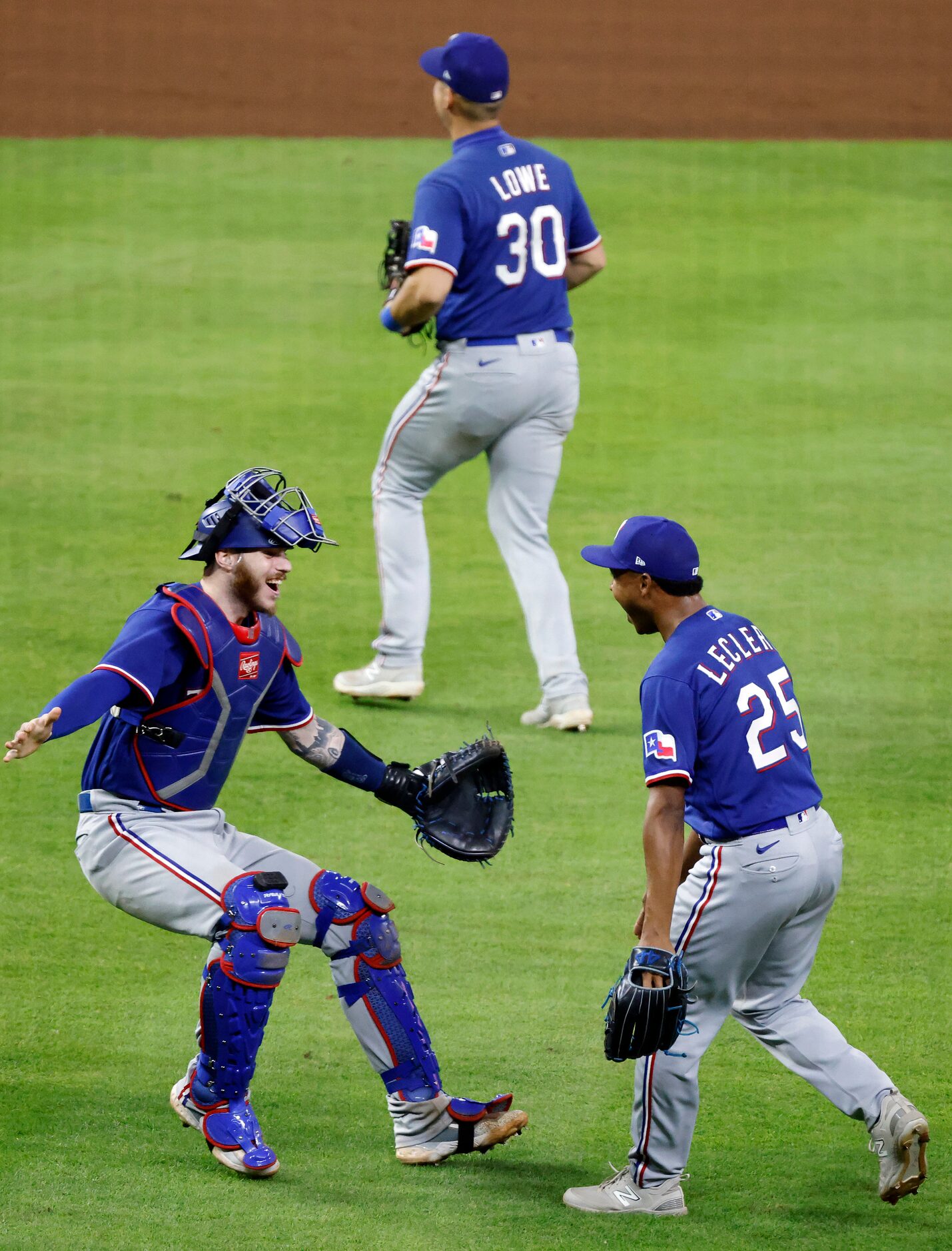 Texas Rangers players Texas Rangers catcher Jonah Heim (left) and relief pitcher Jose...