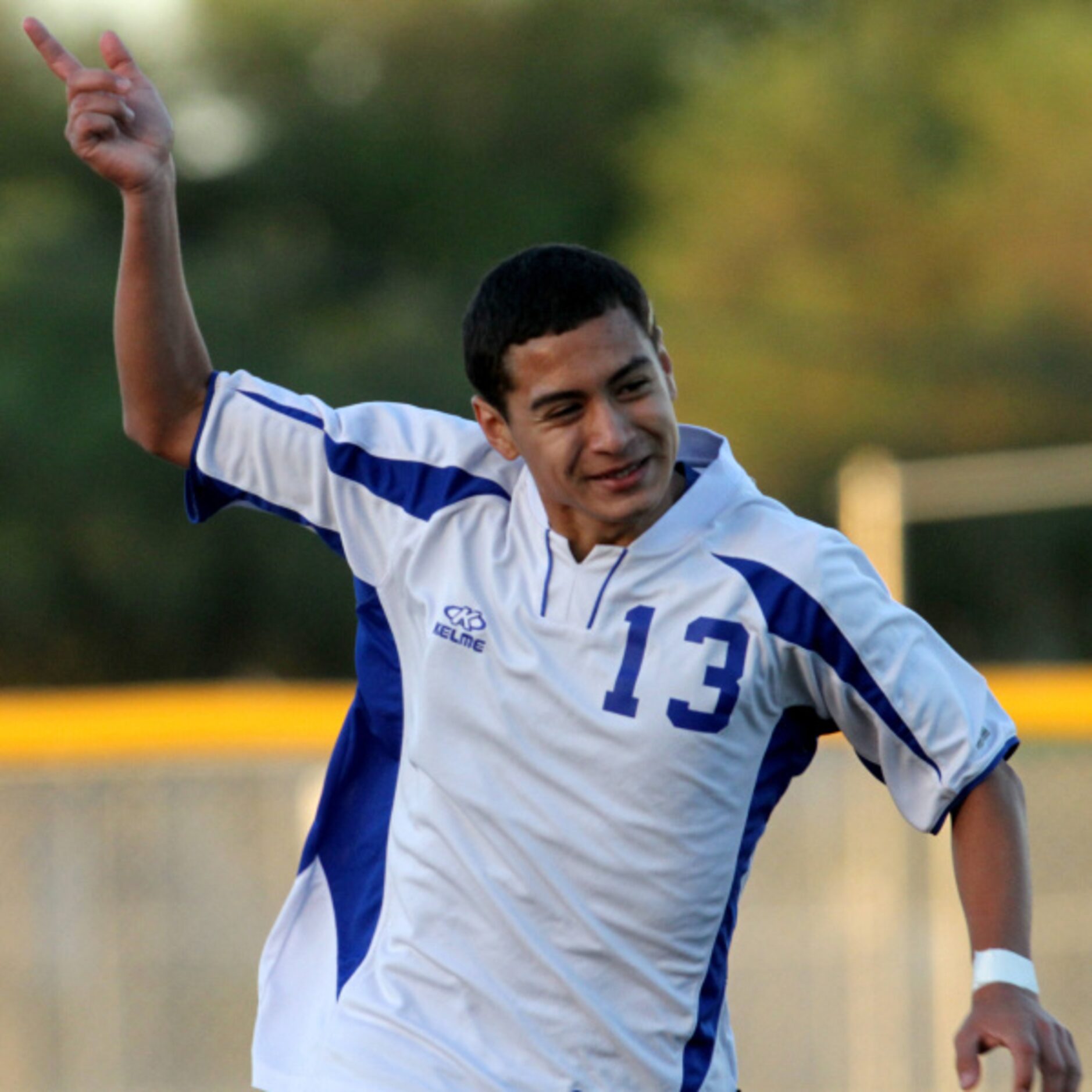 R.L. Turner's Gilbert Aleman (13) celebrates his goal late in the first half to give his...