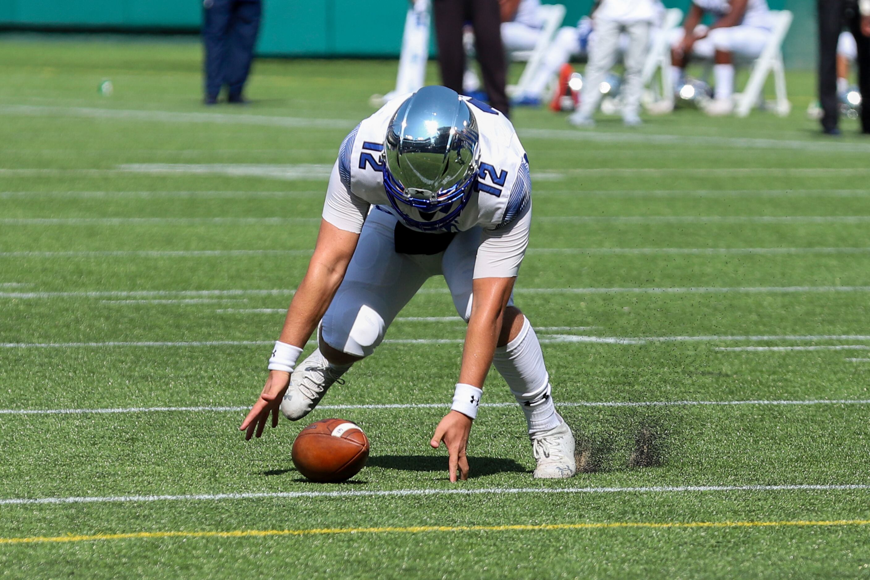 IMG Academy quarterback Jackson Woche (12) recovers a fumble against Duncanville during the...