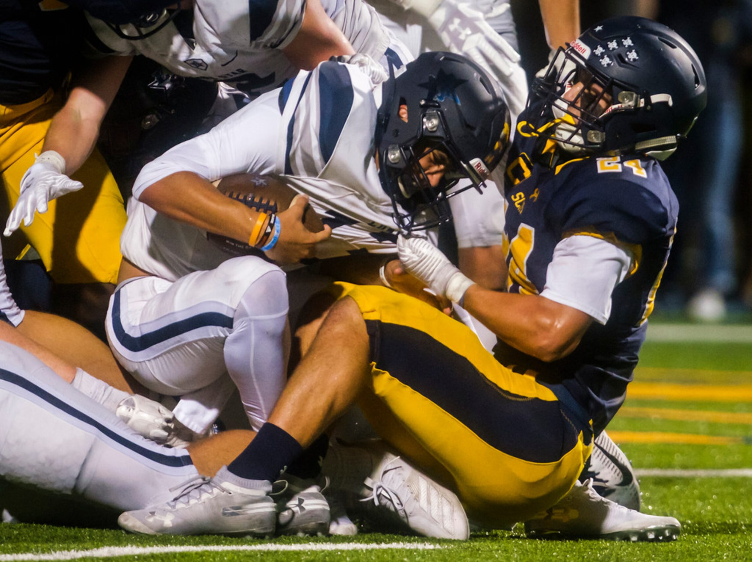 Frisco Lone Star quarterback Garret Rangel (13) is sacked by Highland Park outside...