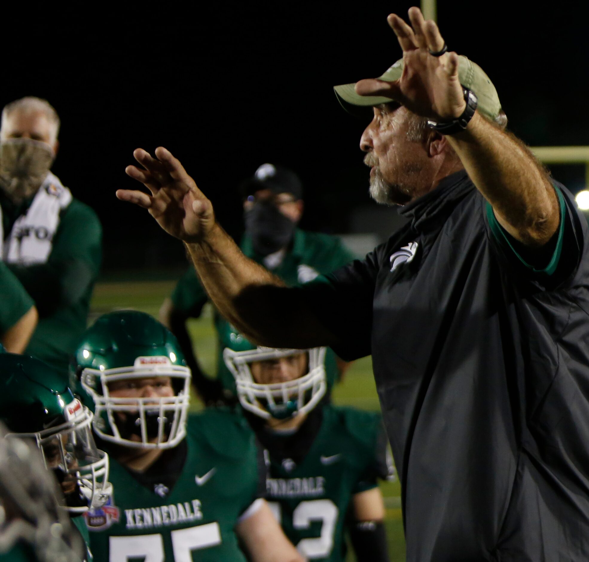 Kennedale head coach Richard Barrett speaks to his players following their 28-27...