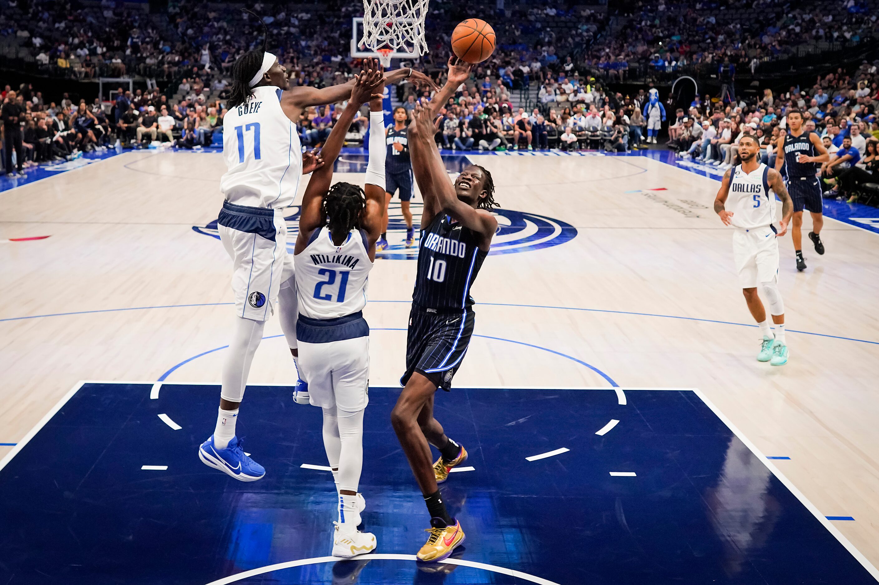 Dallas Mavericks forward Mouhamadou Gueye (17) blocks a shot by Orlando Magic center Bol Bol...