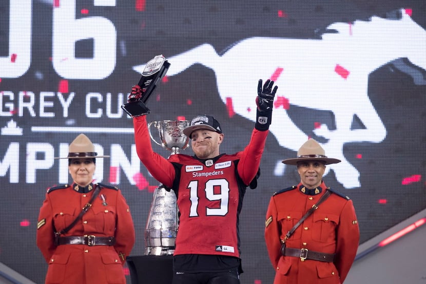 Calgary Stampeders quarterback Bo Levi Mitchell (19) holds up the MVP trophy after the...
