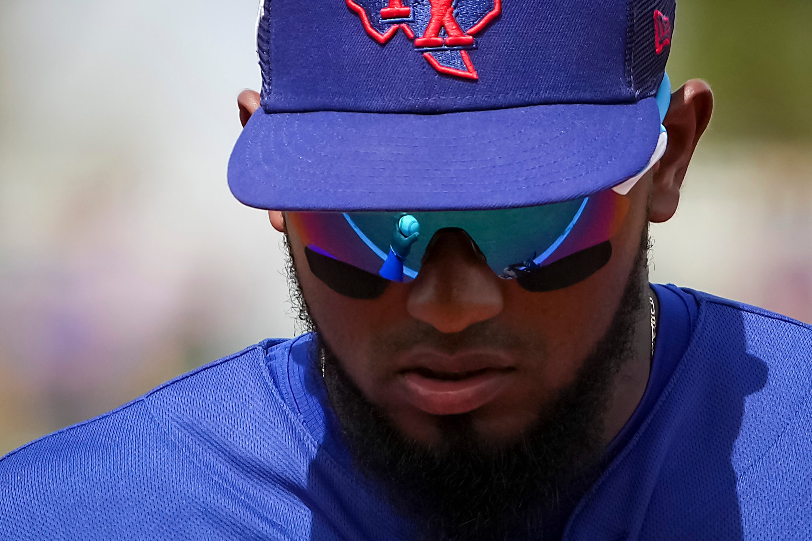 Texas Rangers shortstop Yonny Hernandez heads for the dugout between innings of a spring...