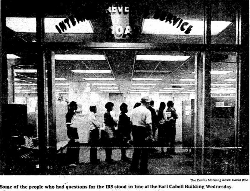 In this 1982 photo, people stand in line to get some last-minute questions answered at the...