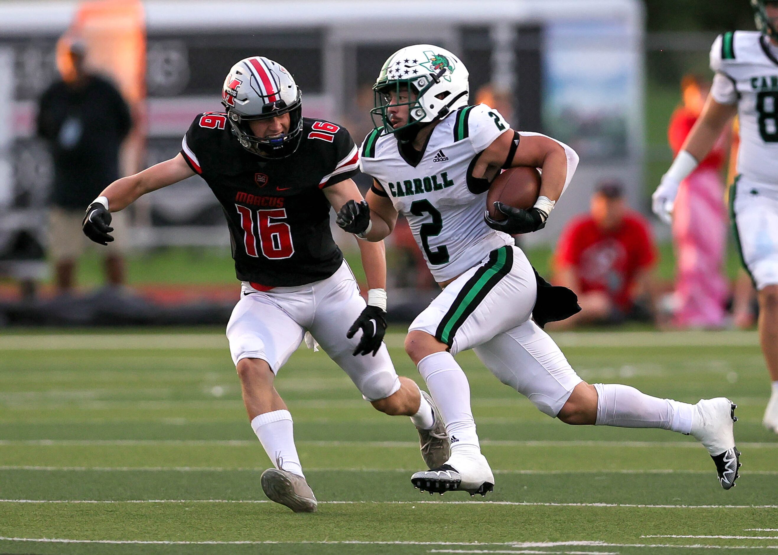 Southlake Carroll running back Owen Allen (2) tries to elude Flower Mound linebacker Brock...