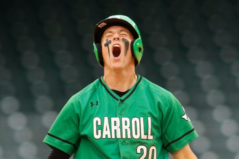 Southlake Carroll infielder Cade Manning (20) lets out a yell after reaching 2nd base...