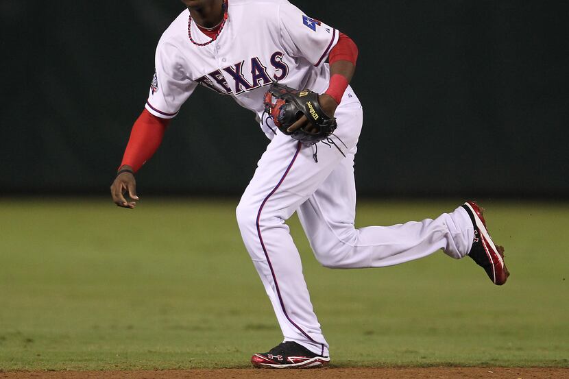 Texas Rangers second baseman Jurickson Profar (2) watches a ball hit to third baseman...