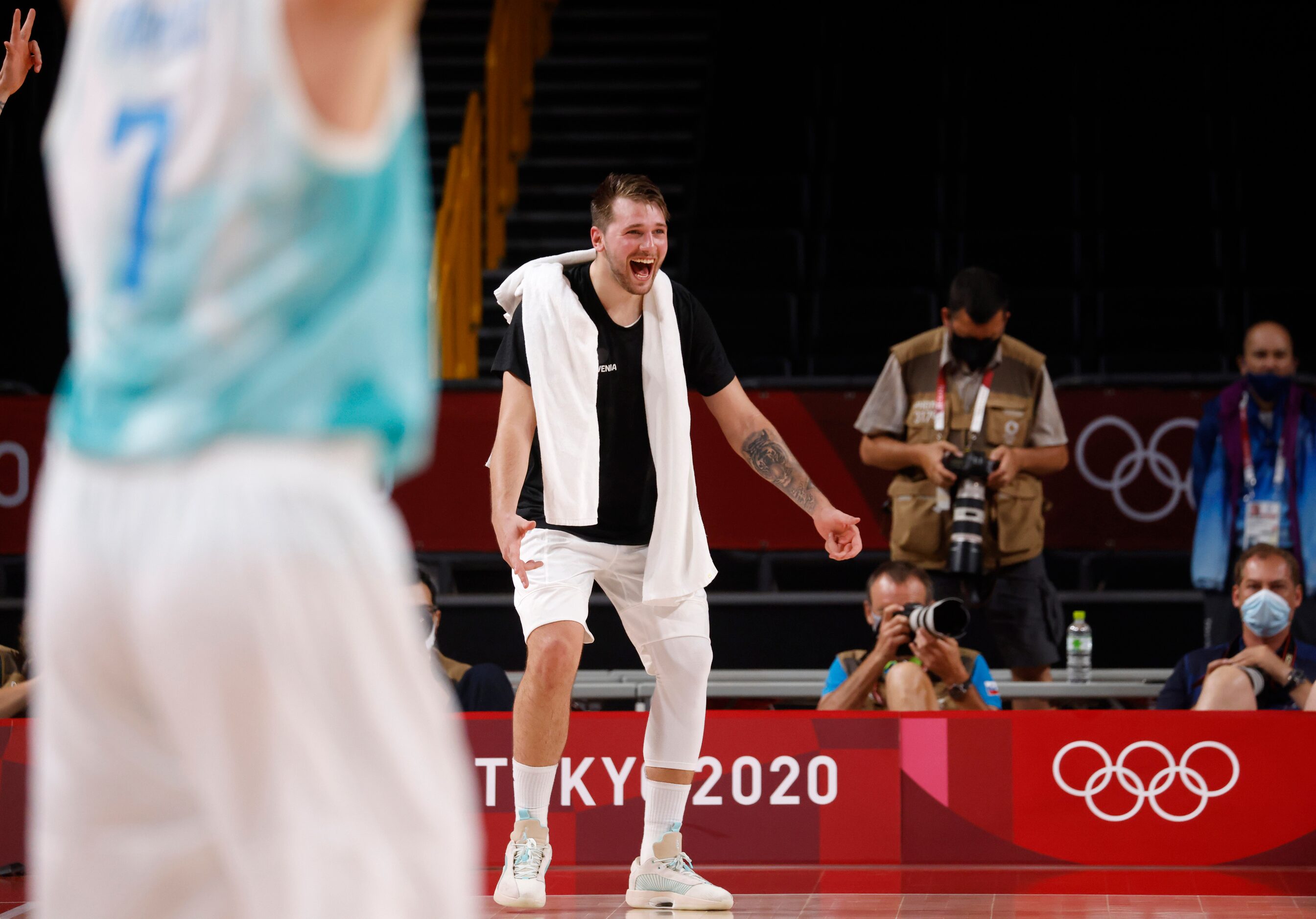 Slovenia’s Luka Doncic (77) celebrates after a made basket as they play Germany during the...