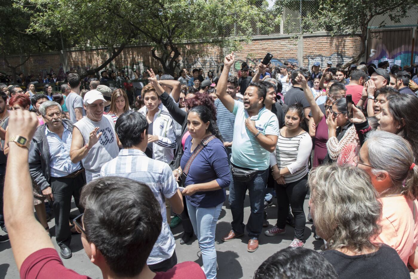 People in Mexico City react to the lack of ballots in the polling station on July 1, 2018 in...