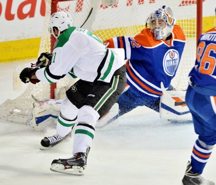 Mar 27, 2015; Edmonton, Alberta, CAN; Dallas Stars center Tyler Seguin (91) shoots wide as...