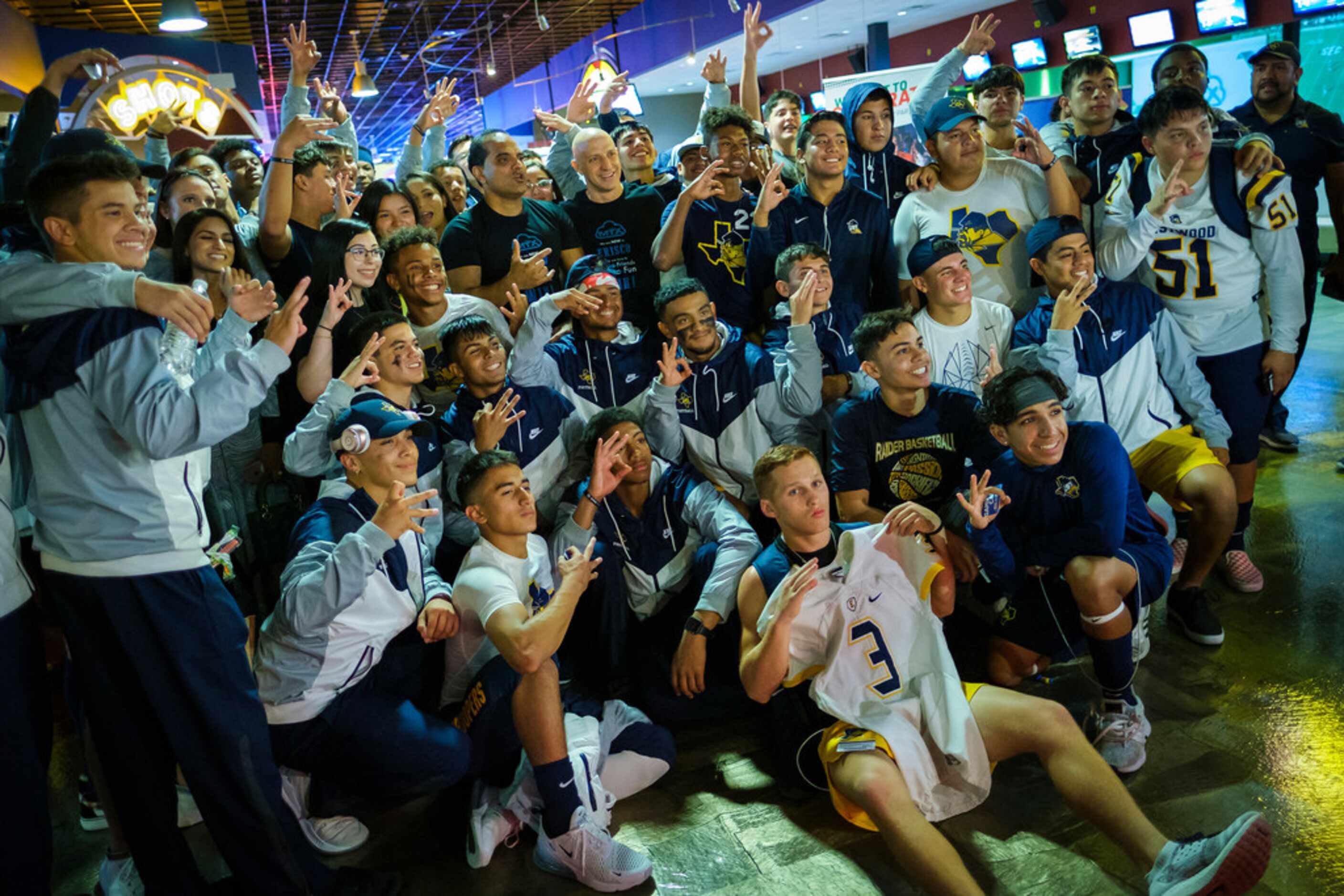 Members of the El Paso Eastwood football team gather for a group photo at the Main Event...