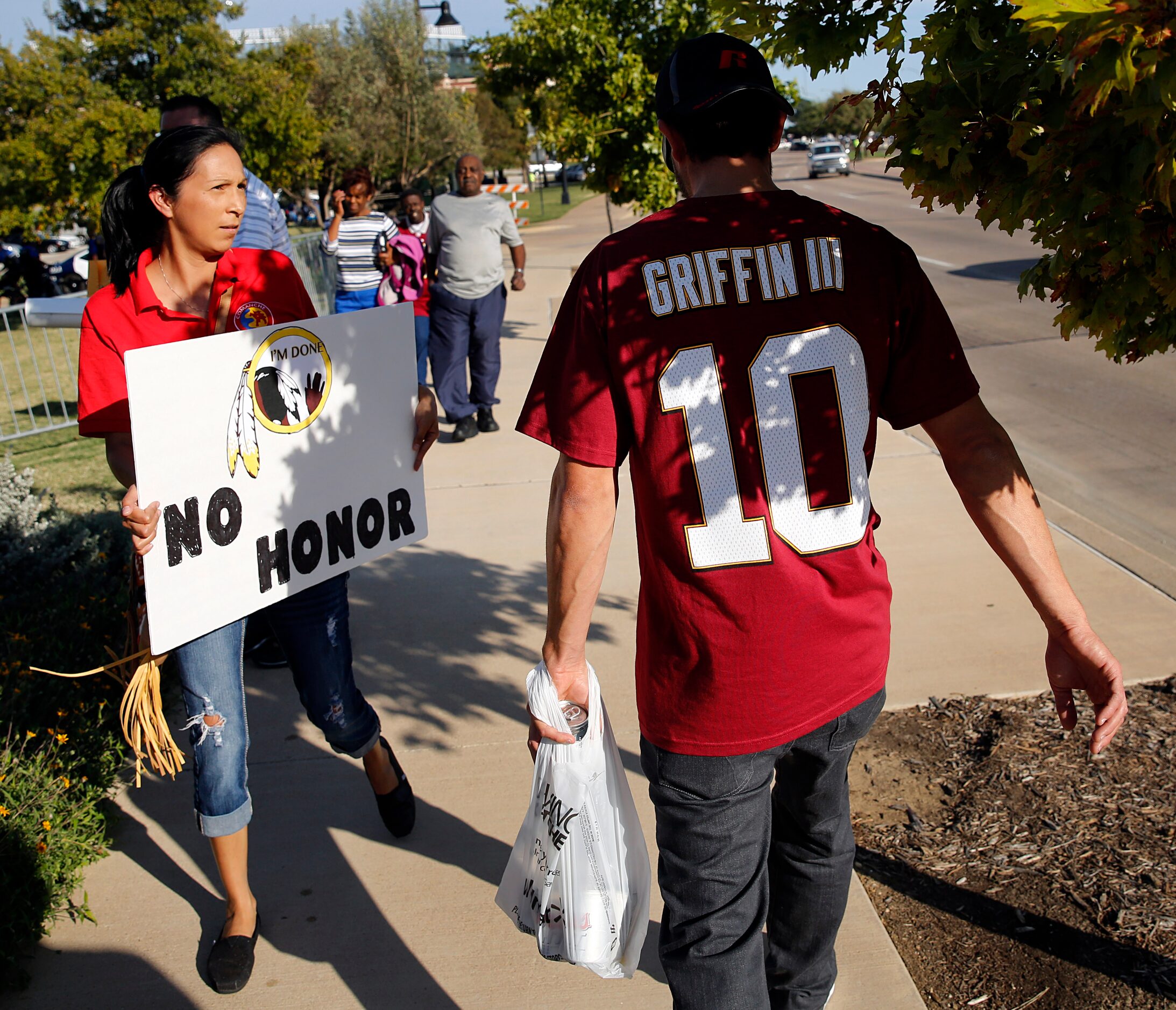 A couple of dozen anti-Redskins protestors marched up and down Randol Mill Rd in front of...