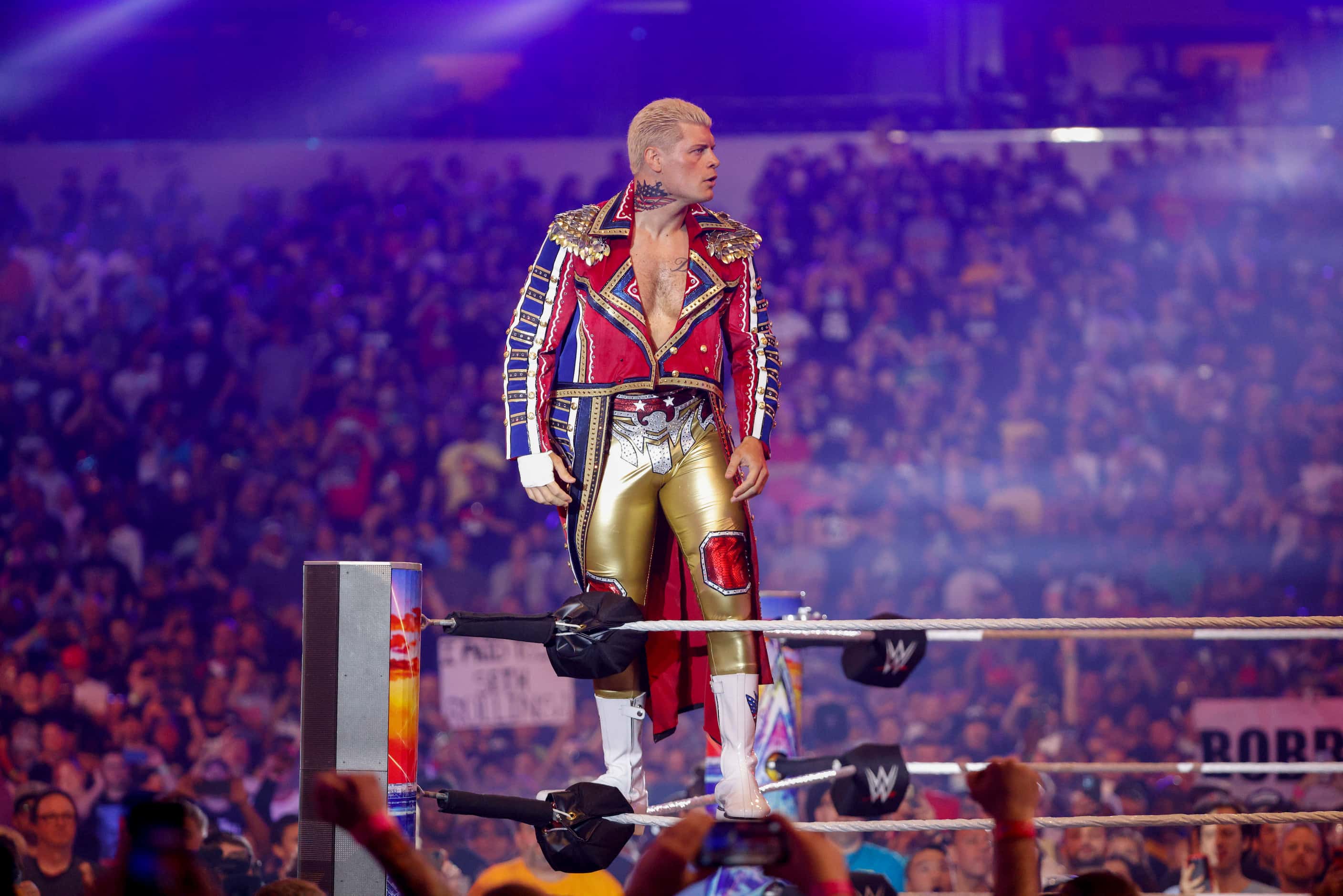 Cody Rhodes enters the ring before a match against Seth Rollins at WrestleMania 38 at AT&T...