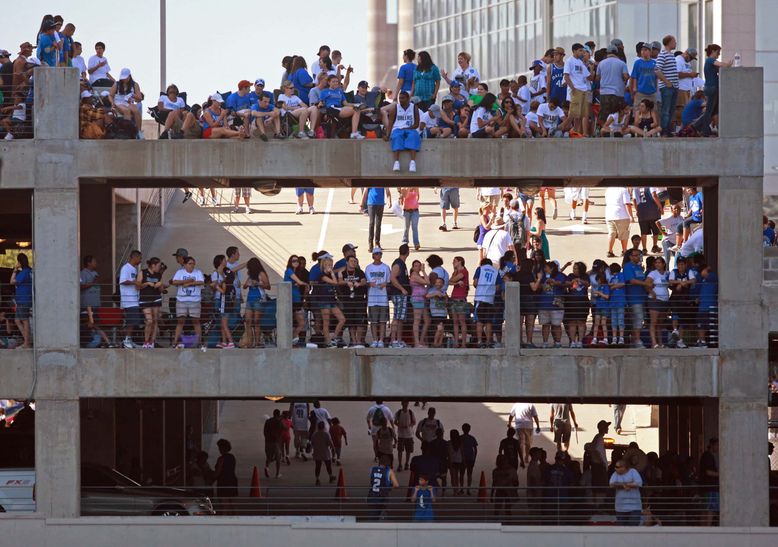People stack on parking garages next to American Airlines center before the 2011 Dallas...