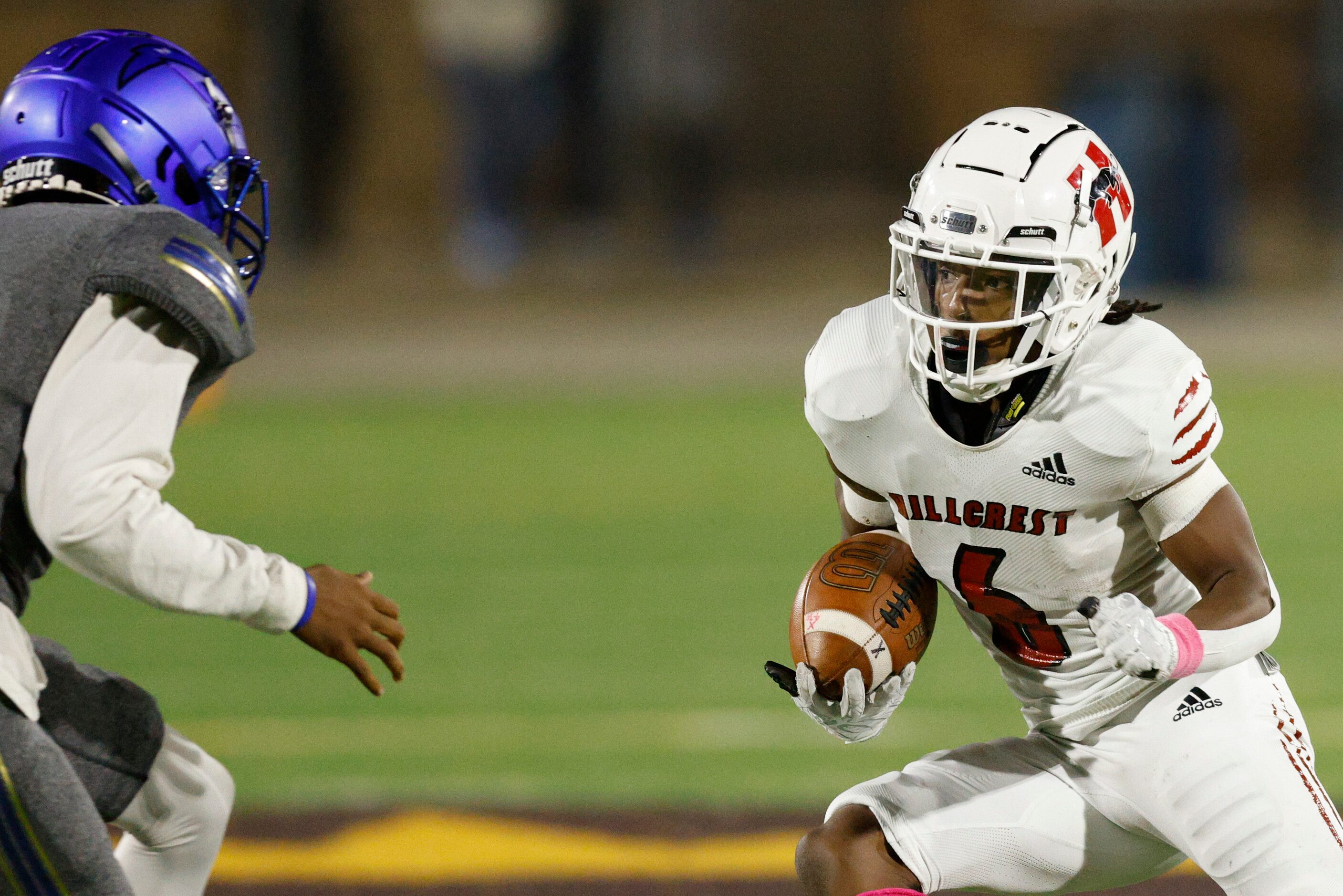 Hillcrest wide receiver Jaden Hodge (6) cuts around Conrad linebacker Isiah Lister (5)...