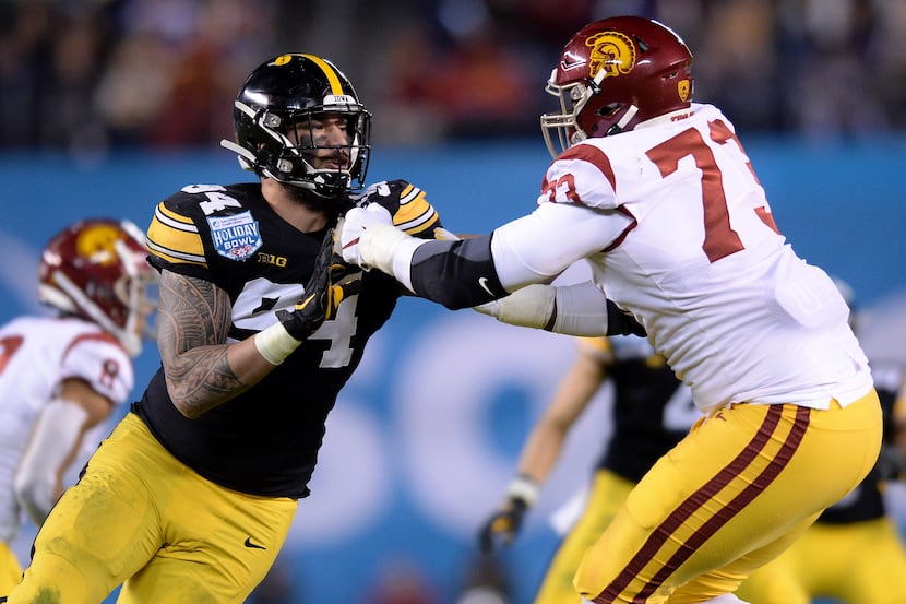 FILE - Iowa defensive end A.J. Epenesa (94) works against USC offensive tackle Austin...