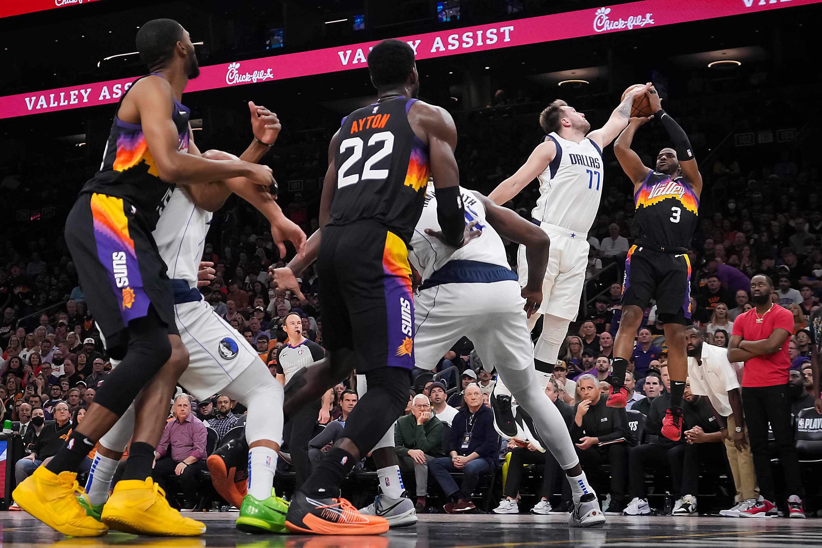 Dallas Mavericks guard Luka Doncic (77) blocks a shot by Phoenix Suns guard Chris Paul (3)...