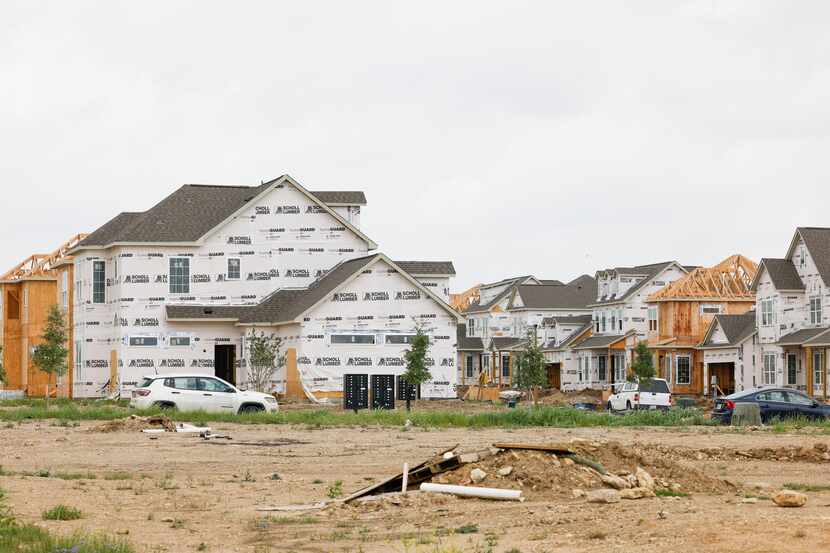 Rental townhomes and single-family houses are shown under construction at the Residences at...