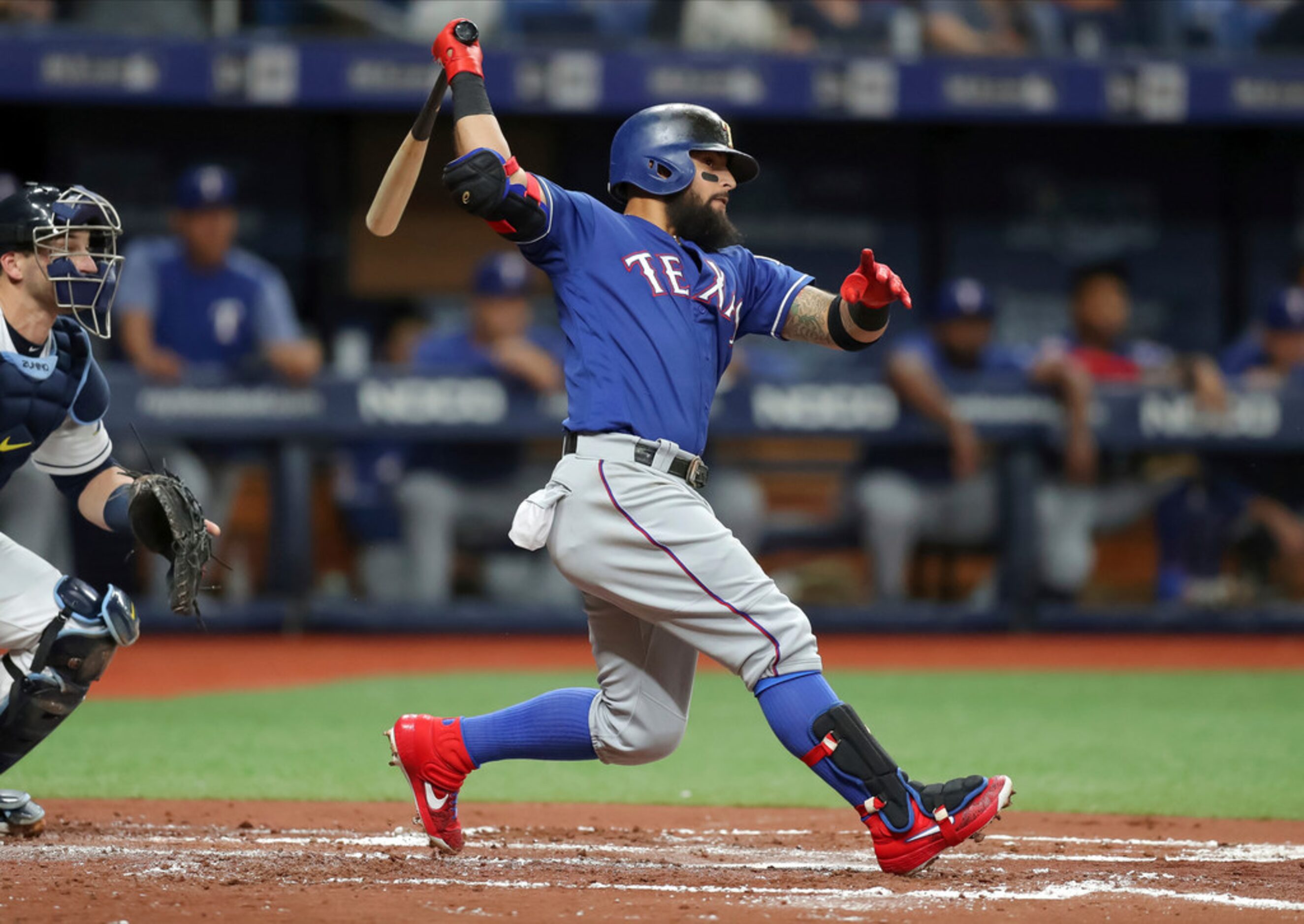 Texas Rangers' Rougned Odor follows through on an RBI double against the Tampa Bay Rays...