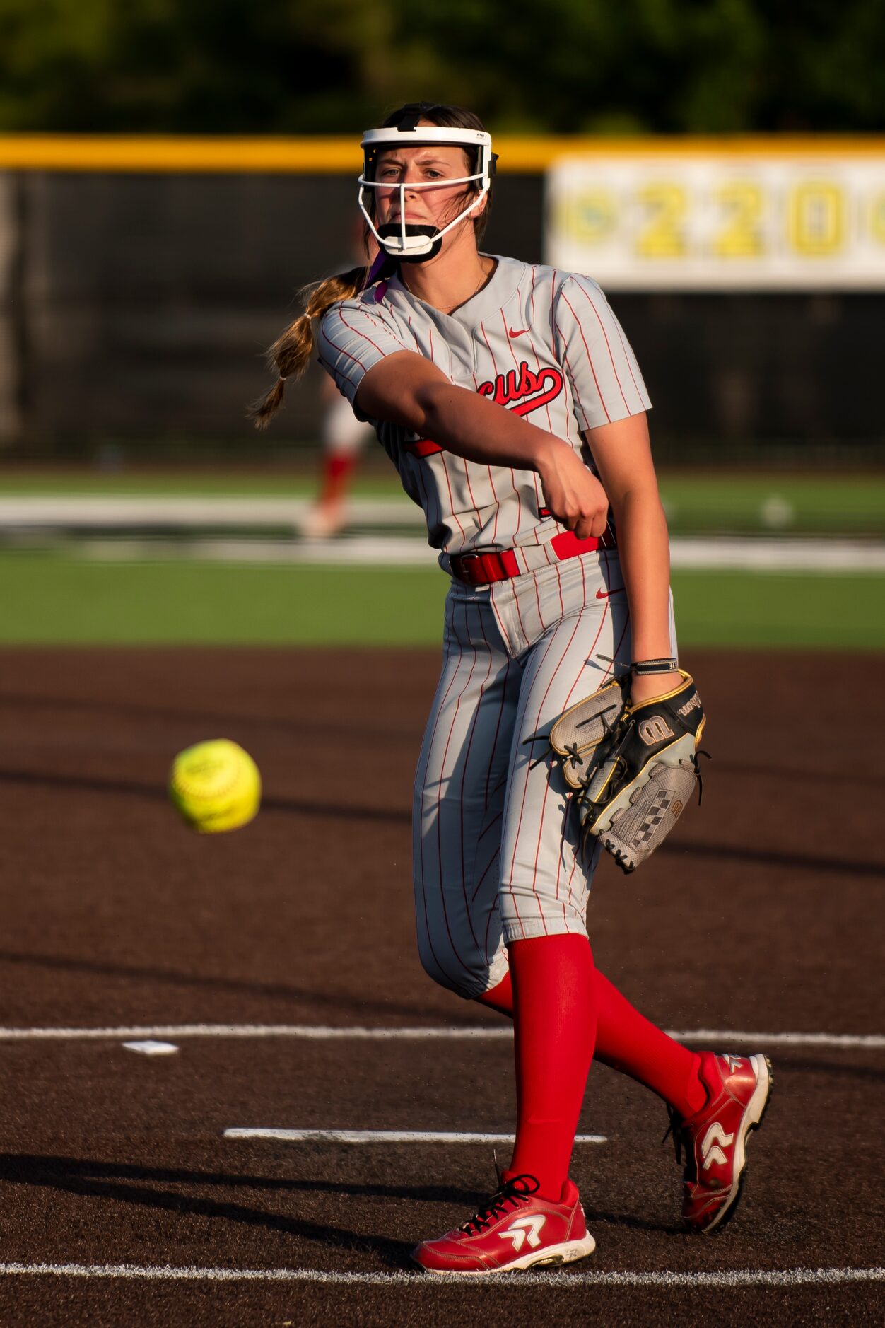 Flower Mound Marcus junior Faith Drissel (1) delivers a pitch during Game One of the Class...