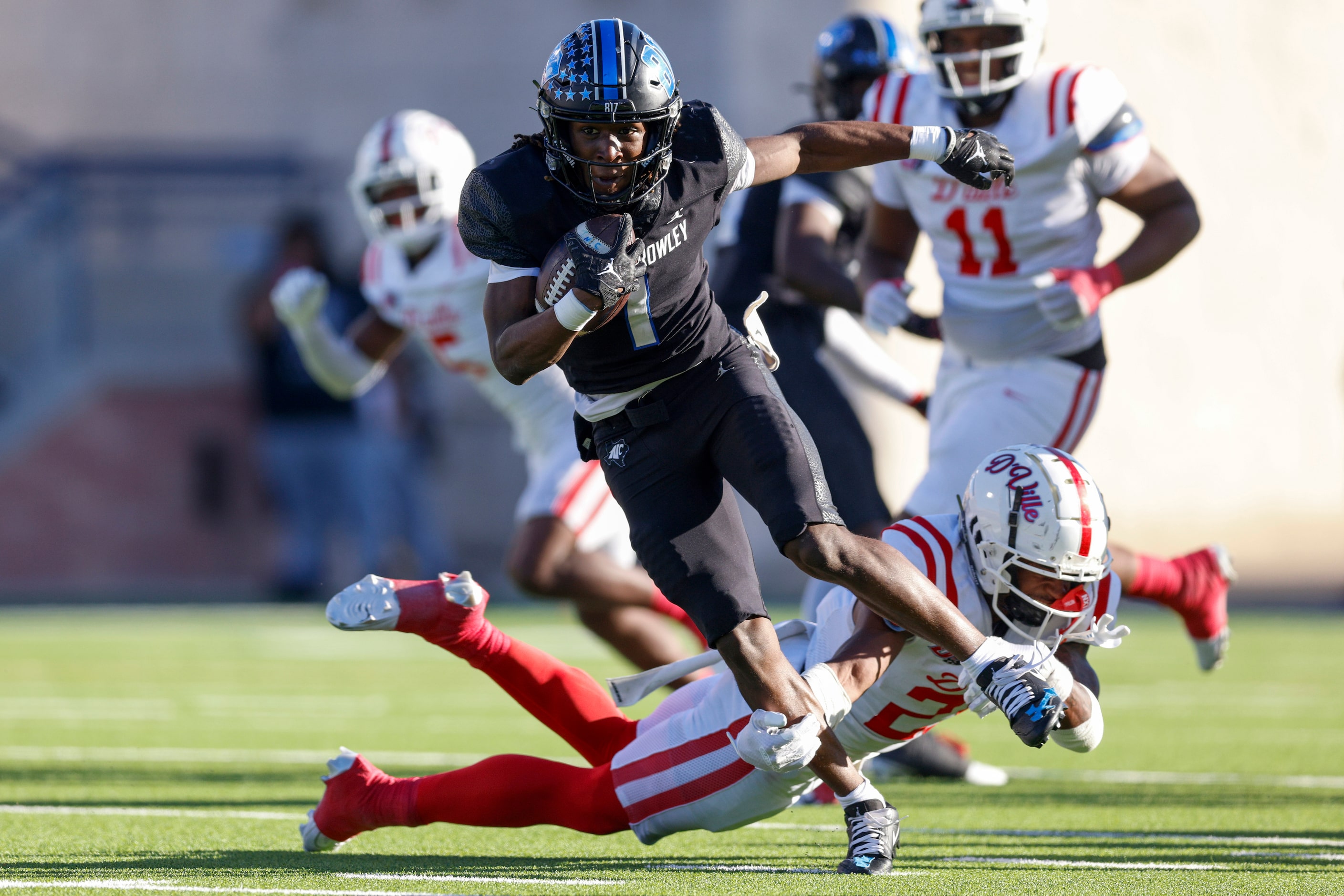 North Crowley running back Cornelius Warren (1) runs through a tackle during the first half...