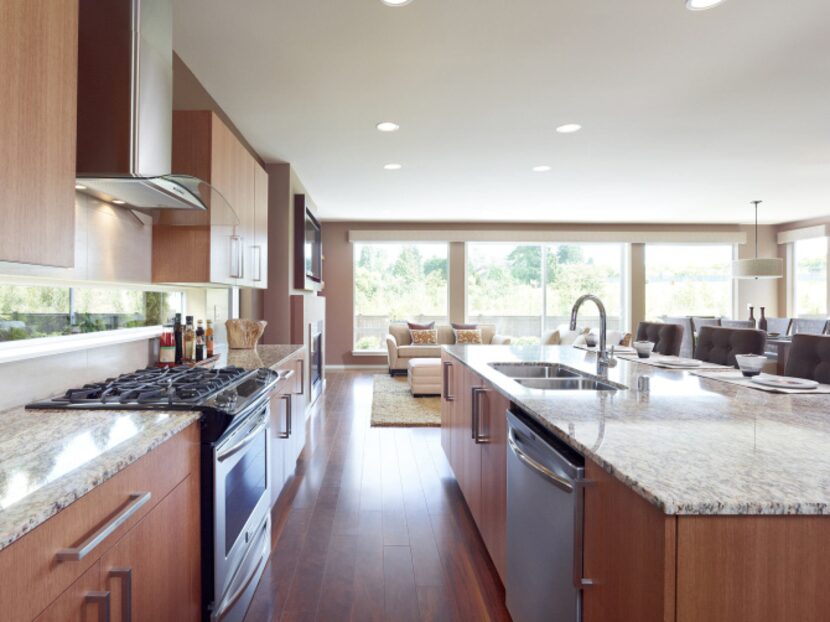 The builder's houses have open floor plans with lots of natural wood and light.