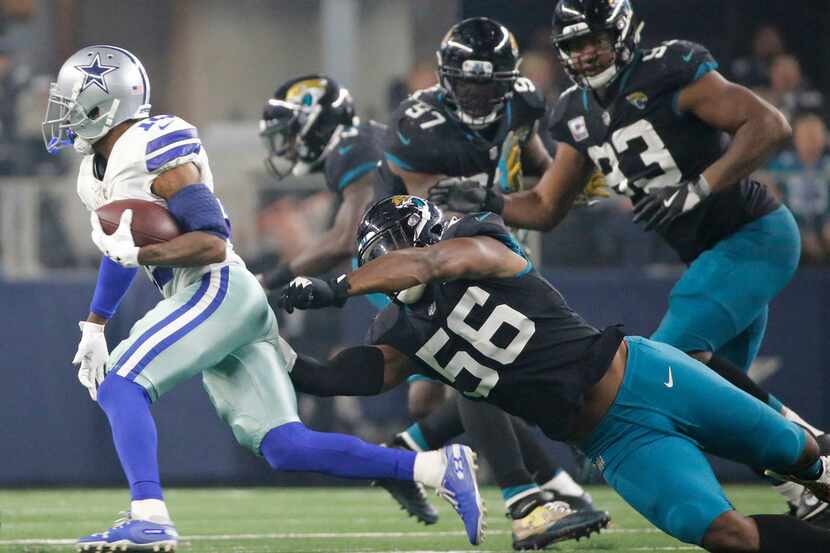 Dallas Cowboys wide receiver Tavon Austin (10) avoids four Jacksonville defendsers on a...