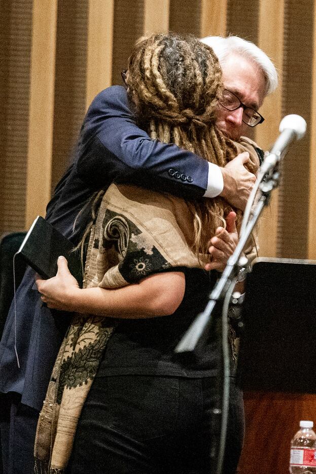 Rabbi David Stern, senior rabbi of Temple Emanu-El, gave Rev. Rachel Baughman a hug after...