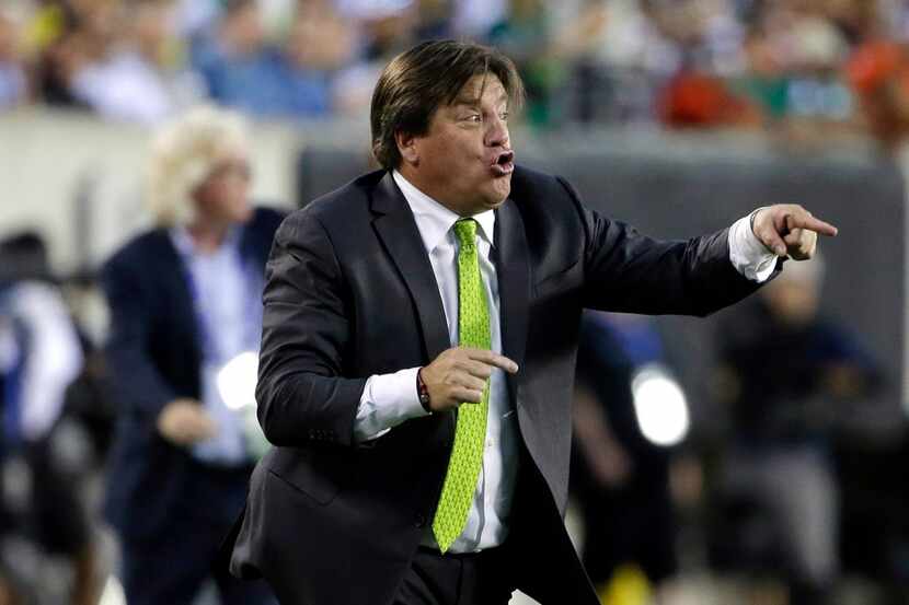 Mexico head coach Miguel Herrera yells during the first half of the CONCACAF Gold Cup...