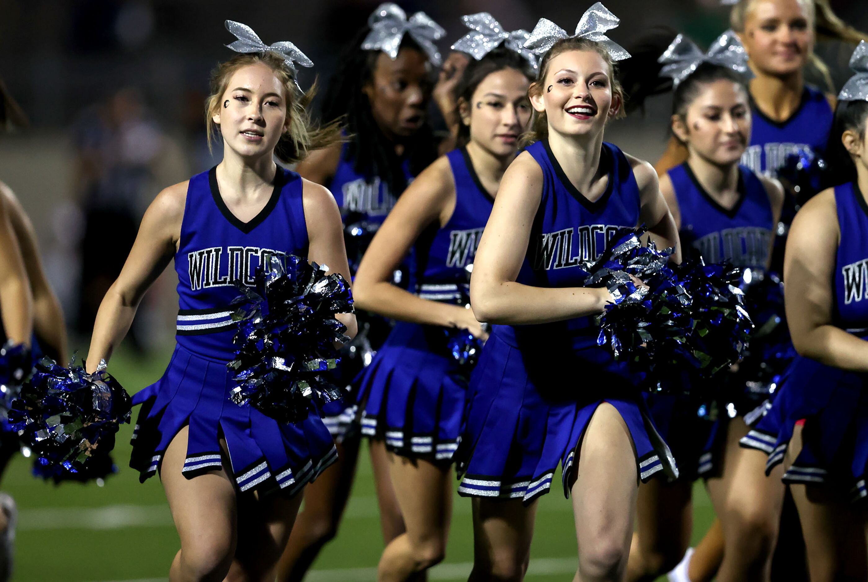 The Denton Guyer cheerleaders perform during the game against Allen in a District 5-6A high...