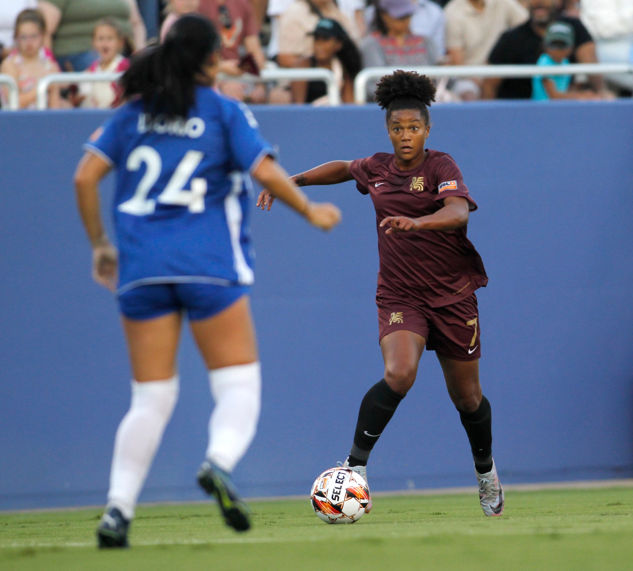 Dallas Trinity FC's Enzi Broussard (7), right, controls the ball as she is defended by DC...