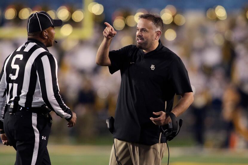 Baylor head coach Matt Rhule, right, complains to the referees during the second half of an...