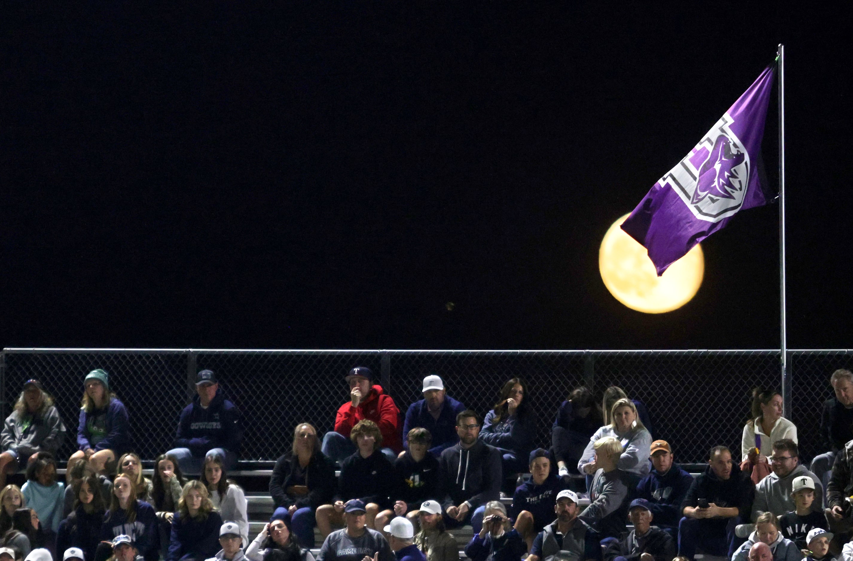 The Anna flag flies over the moon during the Prosper Walnut Grove High School versus Anna...