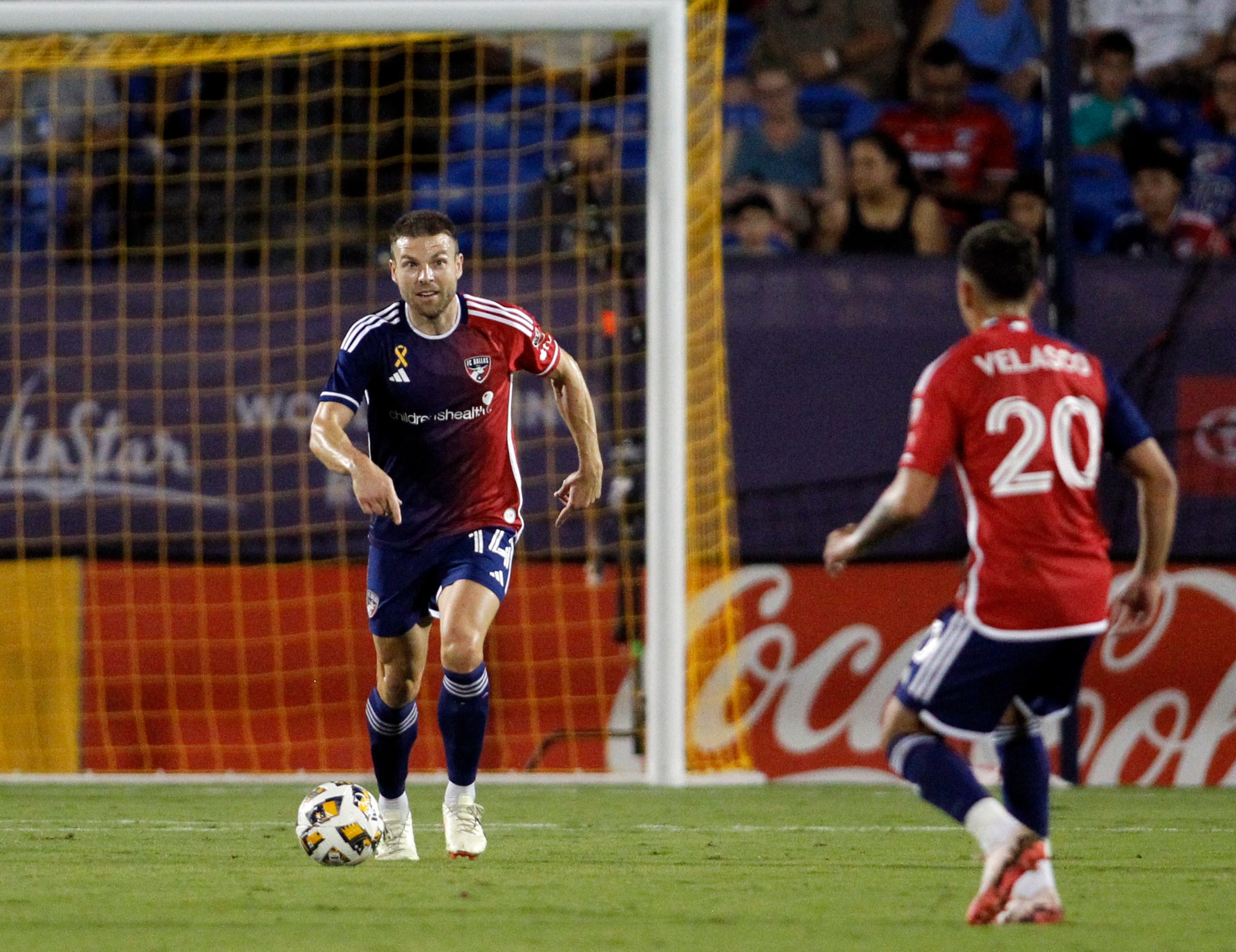 FC Dallas midfielder Asier Illarramendi (14), left, looks to pass to attacker Alan Velasco...