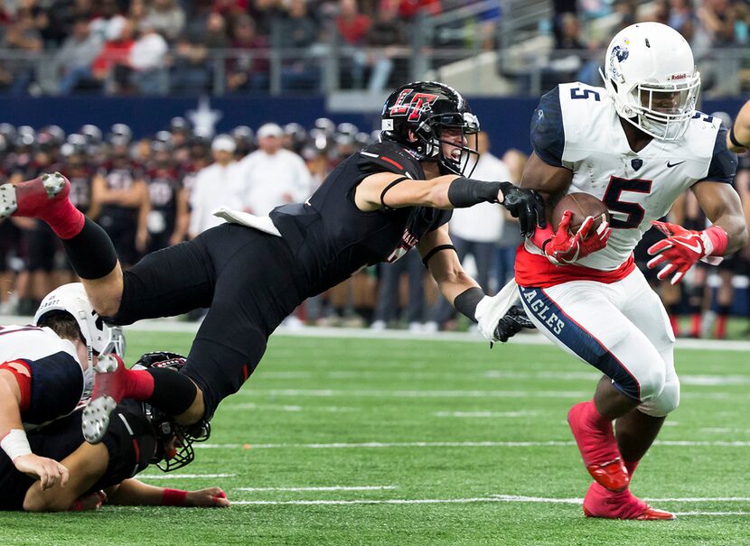 Allen running back Brock Sturges (5) gets past Lake Travis defensive back Ty Badciong (3) on...