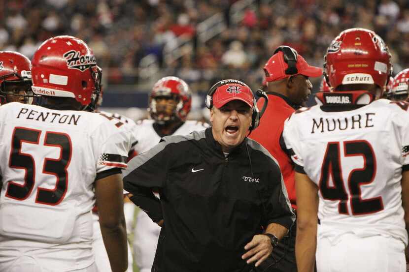 Cedar Hill head football coach Joey McGuire argues a call during the second half of a...