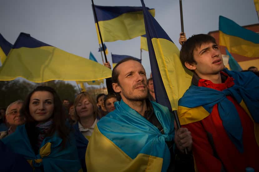 Ukrainians with their national flags gathered in support of a united Ukraine in Donetsk on ...