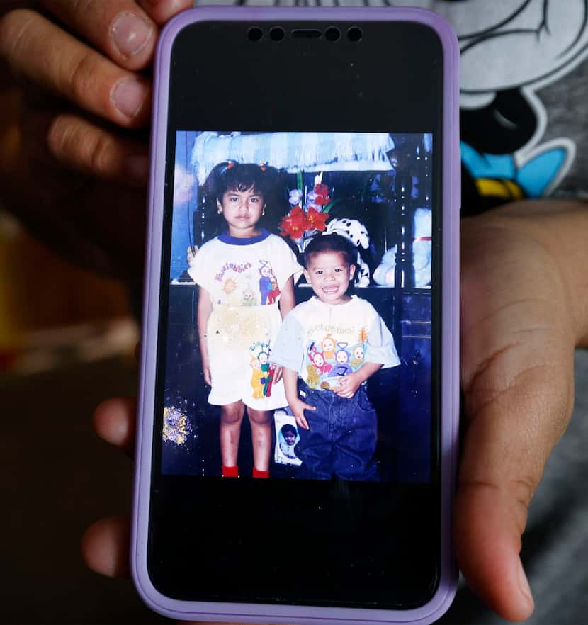 Marcela Chacon Navarrete shows an old photo of her and her brother Jose Fernando Chacon...